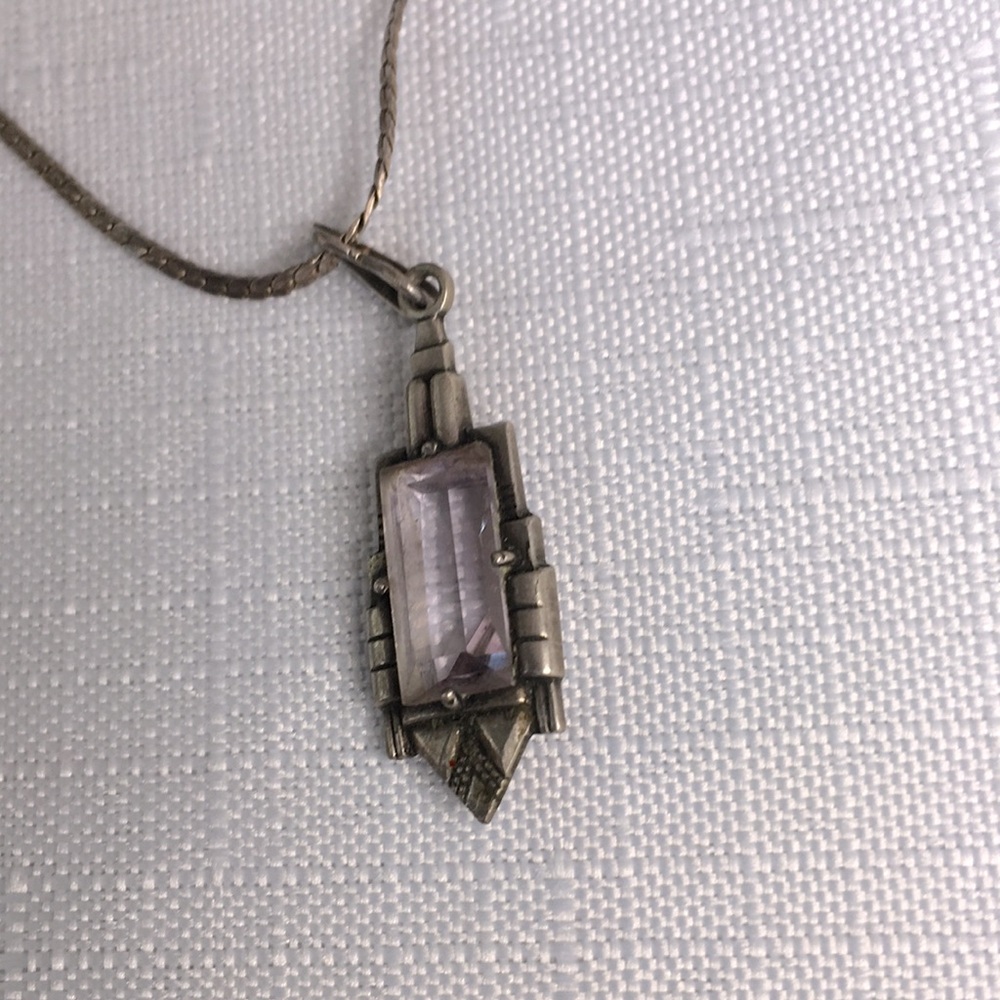 Amethyst necklace with silver chain.